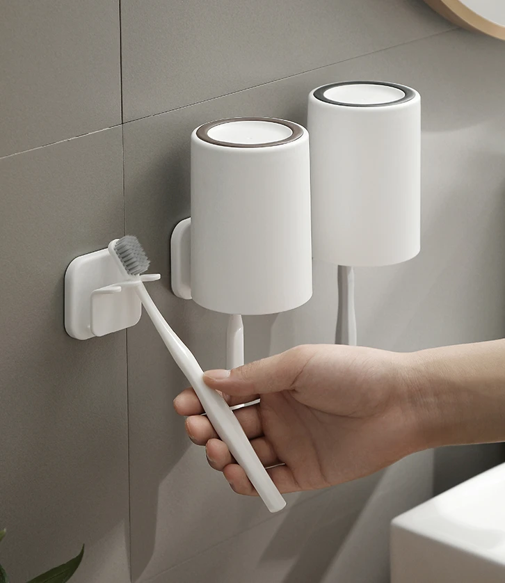 

Toothbrush storage rack with no punching and simple wall hanging adhesive