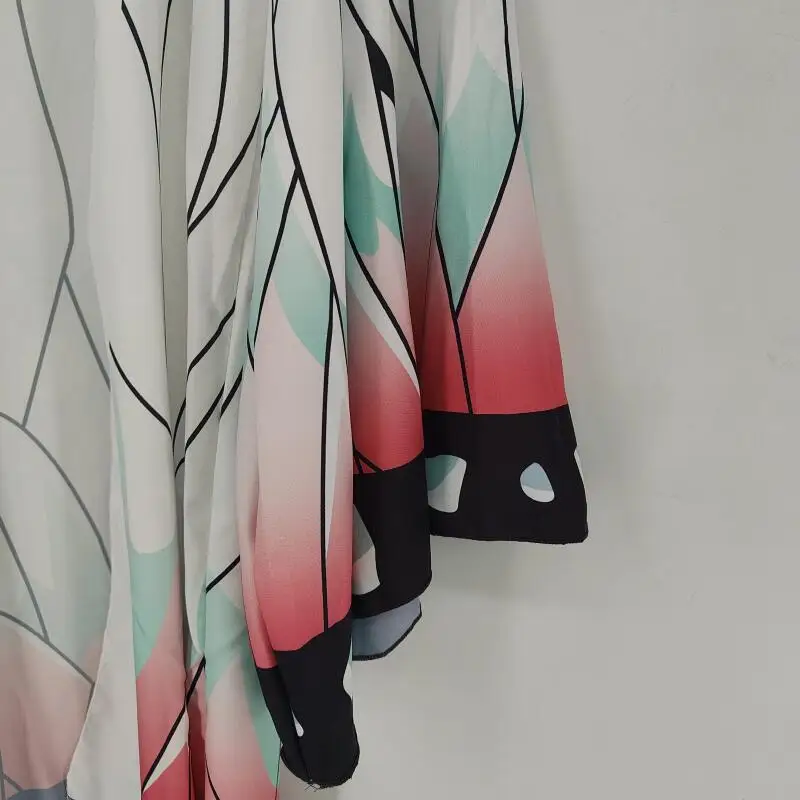 Full-length view of kimono cardigan laid flat