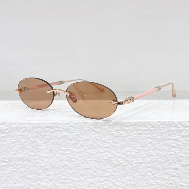 

2024 New Oval Rimless Cut Lens Small Sunglasses Women Men Brand Designer Top Quality Metal Round Frame Pilis Uv400 Glasses