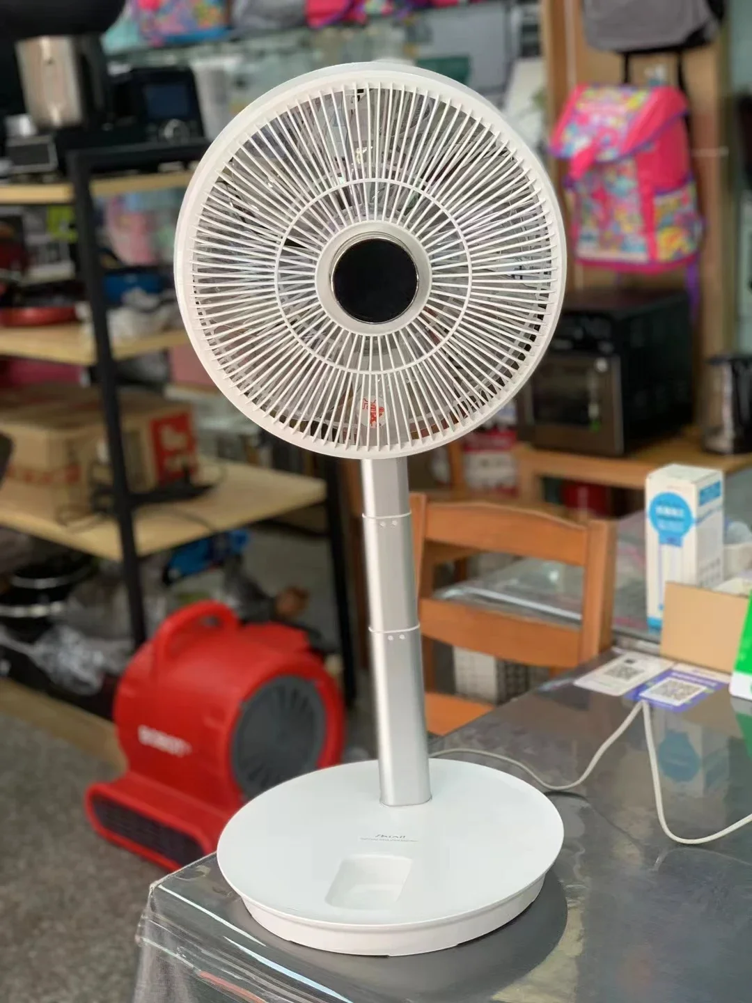 

White alloy bracket for floor mounted fan