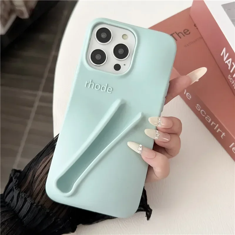thumbnail image 1 of Estuche para teléfono de silicona suave con diseño de lápiz labial para iPhone 11, 12, 13, 14, 15 Pro Max, soporte portátil para brillo de labios Rhode Hailey, 1 of 5