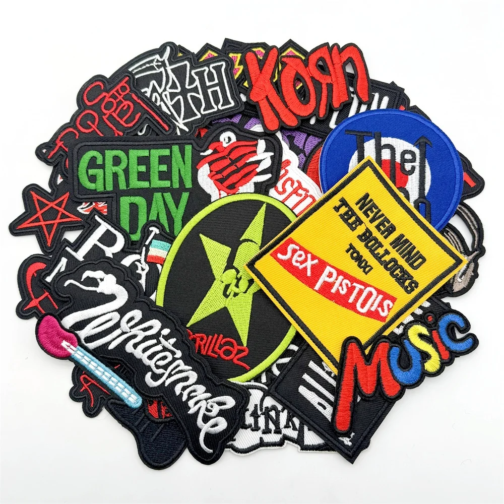 25pcs embroidered rock band patches with logos like Sex Pistols, Green Day, Linkin Park, The Who, and more in bold colors