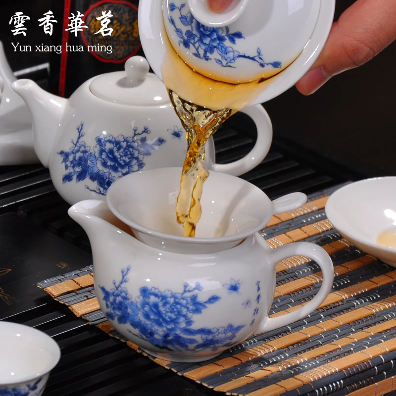 Kung fu tea set the whole kettle set of blue and white porcelain ceramic teapot solid wood tea tray ceremony tea cup tea ceremony tools tea set