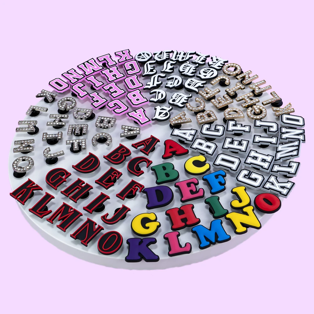 A–Z shoe charm set with mixed LED, PVC, and metal alphabet styles in various colors for personalizing clogs and accessories