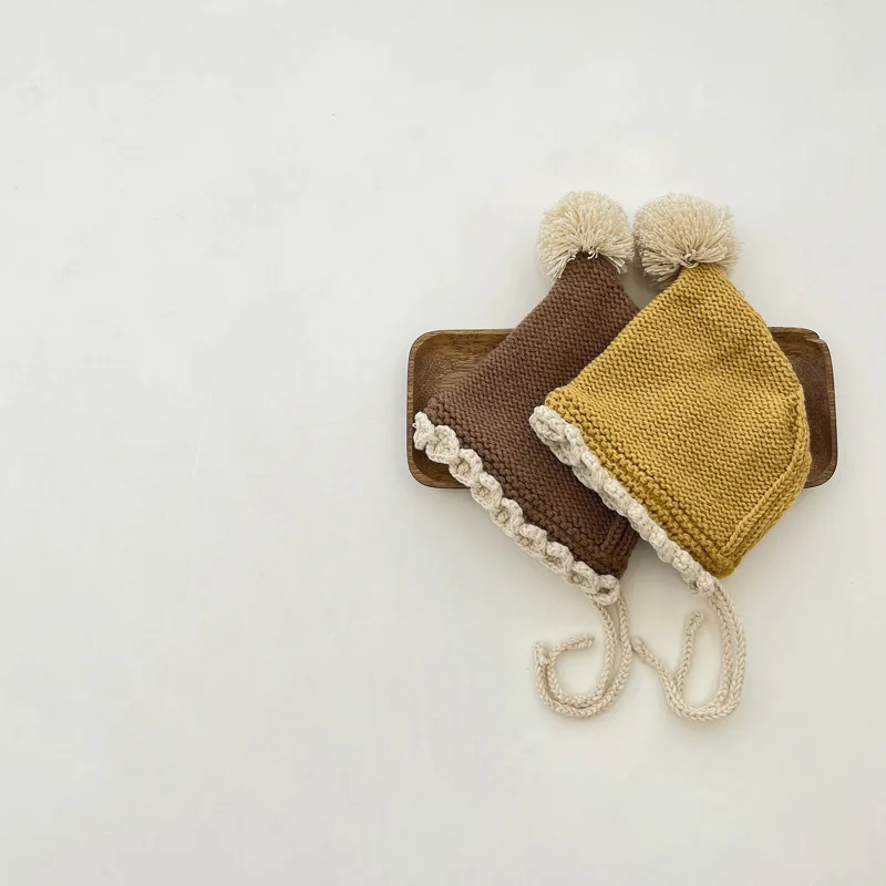 

New Warm Cute baby hat Autumn and winter pure hand woven lace up ear protection cap with cotton newborn pointed cap wool cap