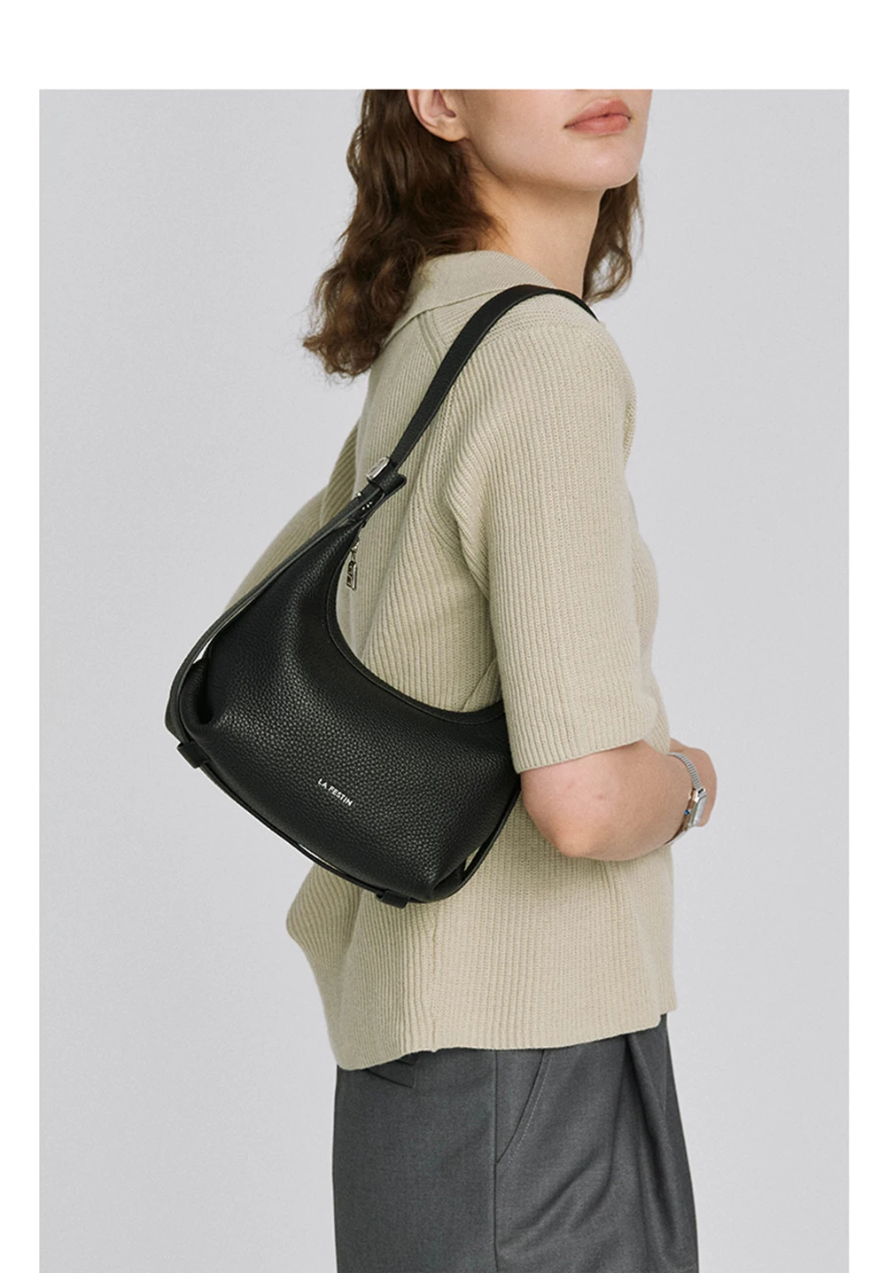 Half moon leather tote, zipper pull detail