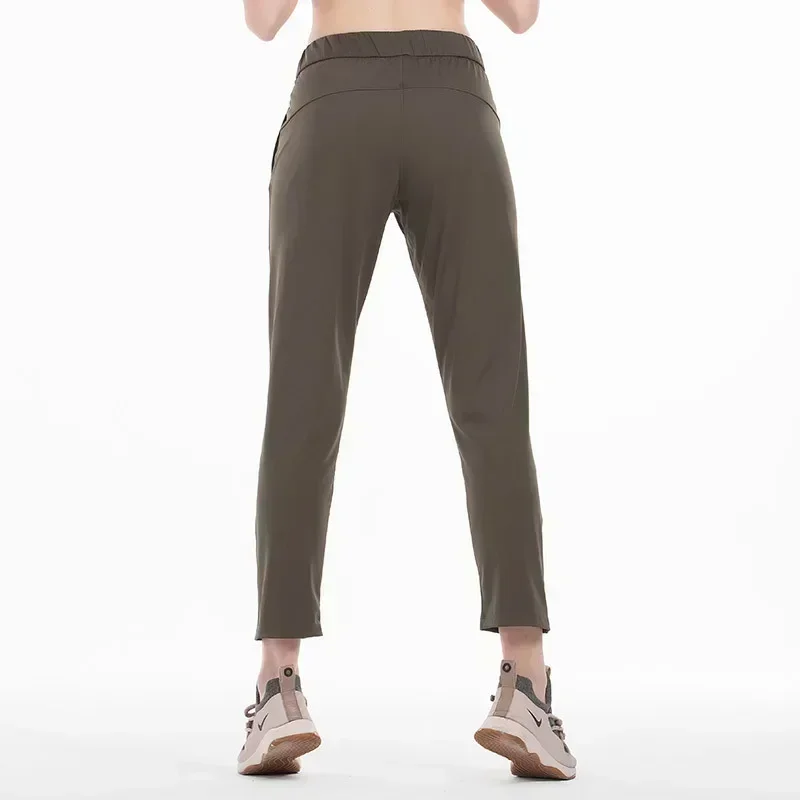 

LuluLogo Women On The Fly Yoga Sport Pants Workout Running Leggings 4 Way Stretch Fabric with Side Pockets Outdoor Gym Trousers