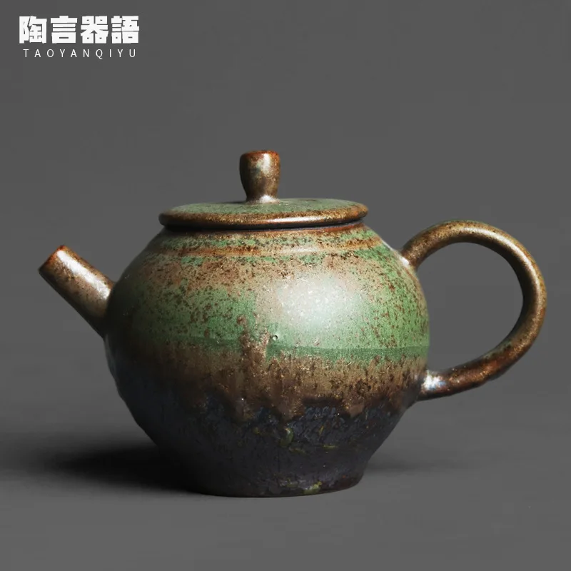 

Kiln baked bronze green glaze gilt texture egg-shaped hand-held teapot handmade retro pottery Kung Fu tea ceremony tea maker