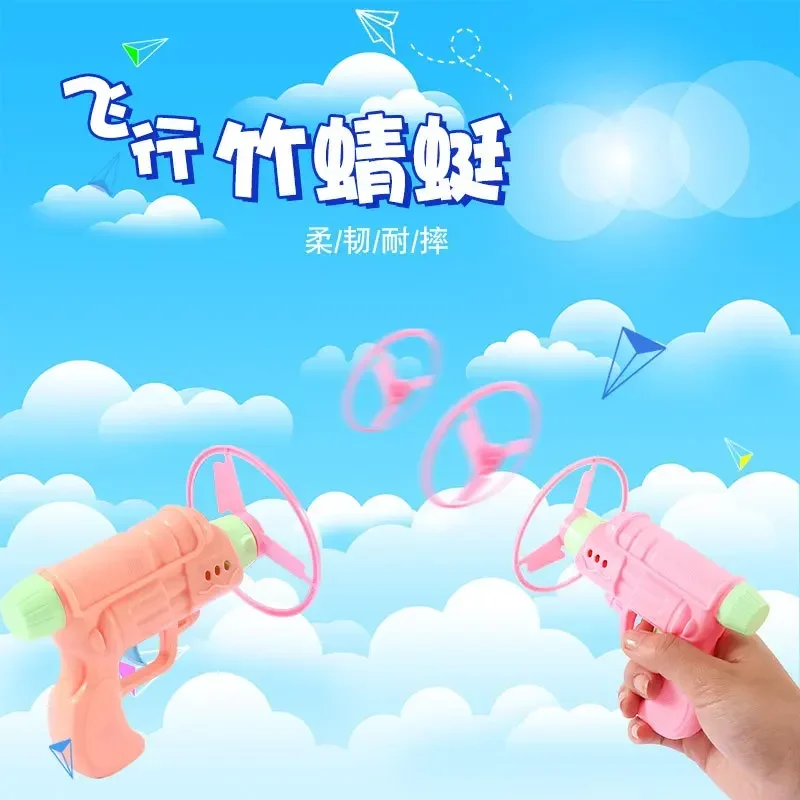 

1PCS Flying Bamboo Dragonfly Flying Saucer Gun Pistol Bamboo Dragonfly Flying Disc Top Outdoor Children Toy Launch Fairy