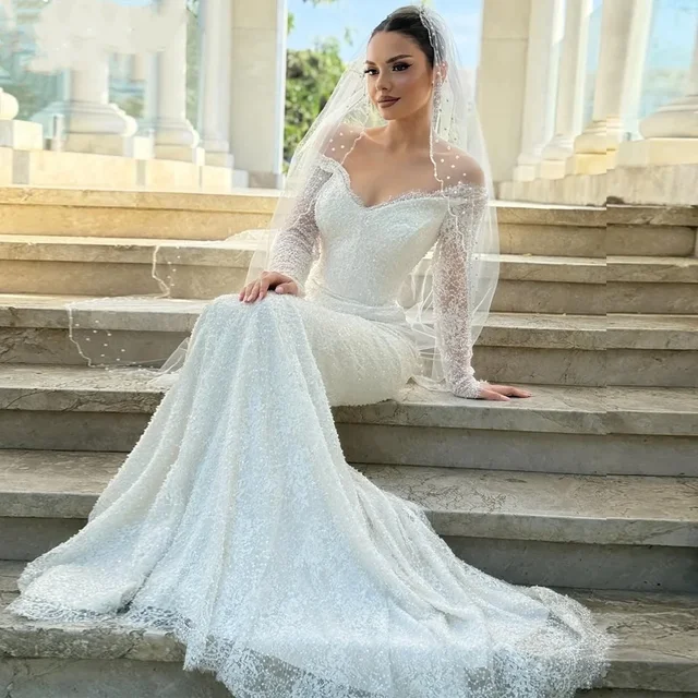 Flavinke فساتين زفاف بحورية البحر بيضاء لامعة مخصصة بأكمام طويلة على شكل قلب مزينة بالدانتيل فيستدو دي نوفيا 1