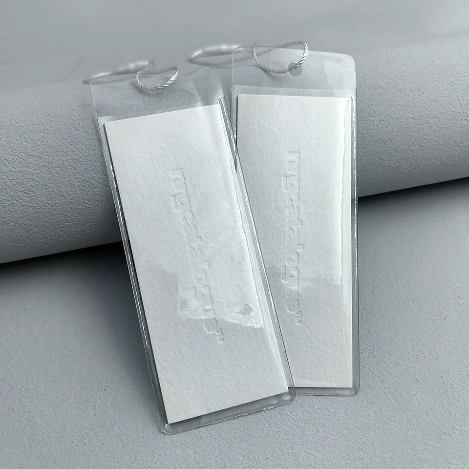 

Custom Colorless Debossed Logo Patterns Specialty Paper New Clothing Hangtag With PVC bags