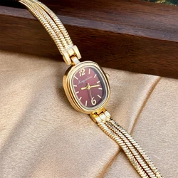 Elegant Gold Ladies' Watch with Oval Bead Face and Fringe Tassel Band (Golden red)