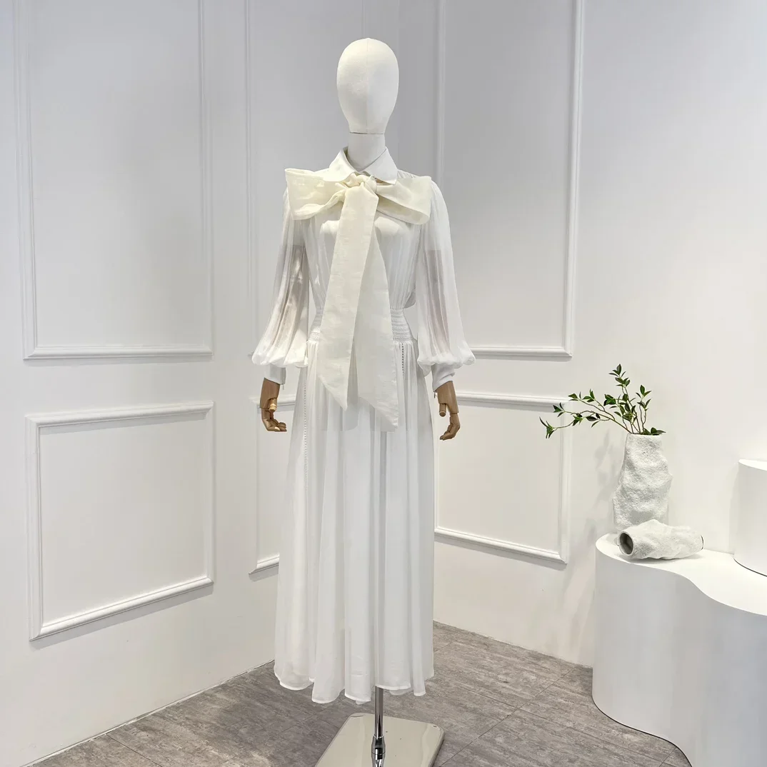 

Платье-миди с большим бантом на рукавах и пуговицах