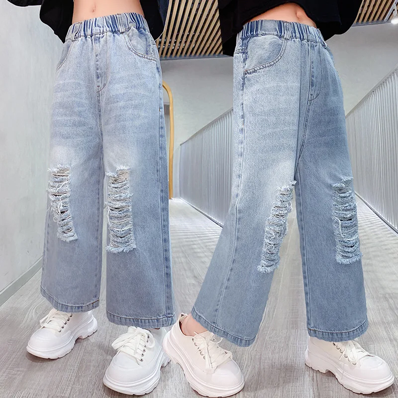 

Новые демисезонные модные рваные джинсы для девочек, джинсовые брюки для детей, корейские подростковые свободные брюки, одежда для девочек
