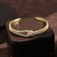 RAKOL Luxury MicroPaved Zircon Geometric Cross Splicing Open Bangles For Women Gold Color Adjustable Double Layer Bangle Jewelry 1
