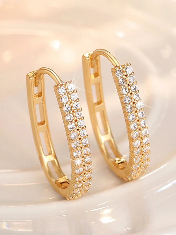 Close-up view of CZ stones on hoop earrings