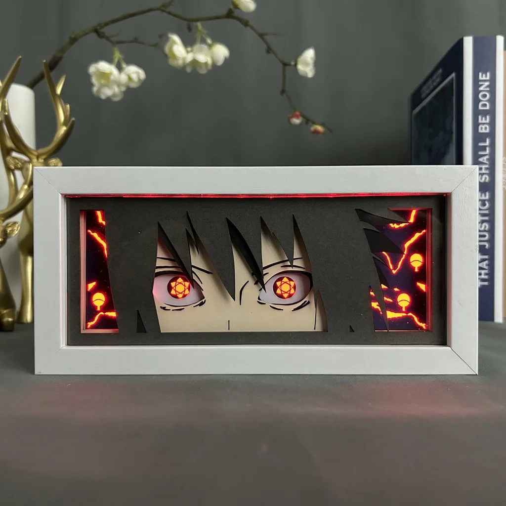 thumbnail image 1 of Periféricos de anime de NARUTO, figura de Itachi con luz LED, caja de sombras cortada con papel, figuras de Sasuke, caja de luz, estatua de Obito, adornos de escritorio, juguetes, 1 of 5