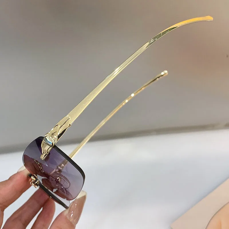 Stylish rimless rectangle sunglasses with tinted lenses and gold temples