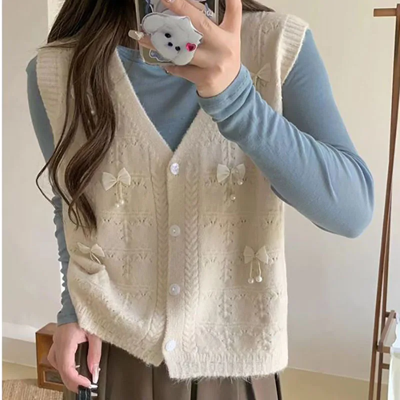 

2023 New Autumn Winter Fashion Women Vest 3D Bow V-Neck Stripe Knitted Vest Casual Loose Swee Sleeveless Cardigan Sweater Vest