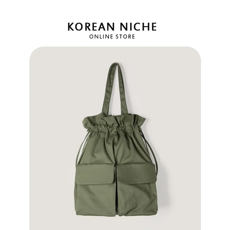 

Original Korean Harajuku style cargo wear large pocket drawstring corset pleated design sense niche canvas backpack
