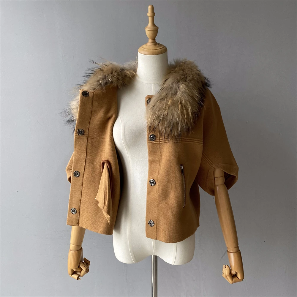 Removable raccoon style collar on cream sweater
