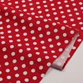 White dots on red