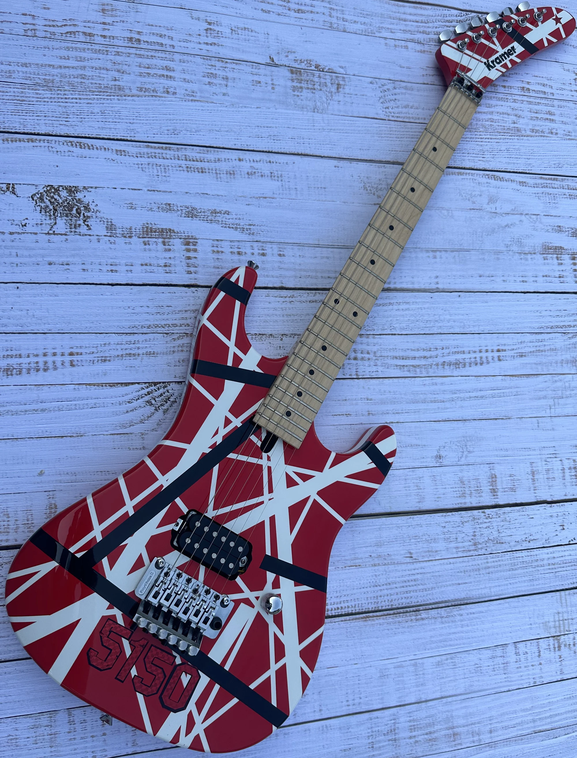 

5150 electric guitar, imported alder body, Canadian maple fingerboard, signed, classic red and white stripes, lightning package