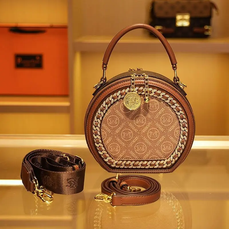 

Light luxury women's bag, popular genuine leather, niche design, women's crossbody bag, internet famous handheld round cake bag,