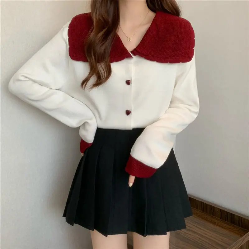 

Japanese fashionable knitted sweater women red top design niche new doll collar trendy contrasting color short cardigan urban