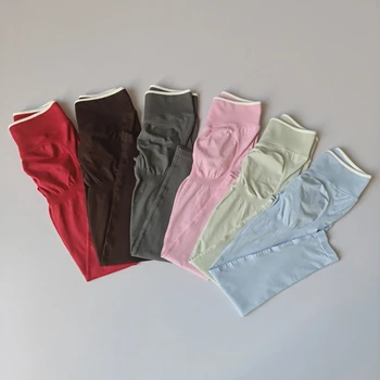 Pantaloni sportivi da palestra in tinta unita senza cuciture da donna Pantaloni da yoga per sollevamento fianchi a vita alta attillati con bordo bianco Pantaloni da allenamento per corsa