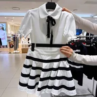 Nouvel ensemble de golf pour femmes : T-shirt polyvalent et élégant à manches courtes avec col et nœud, à porter avec une jupe ou un short 3