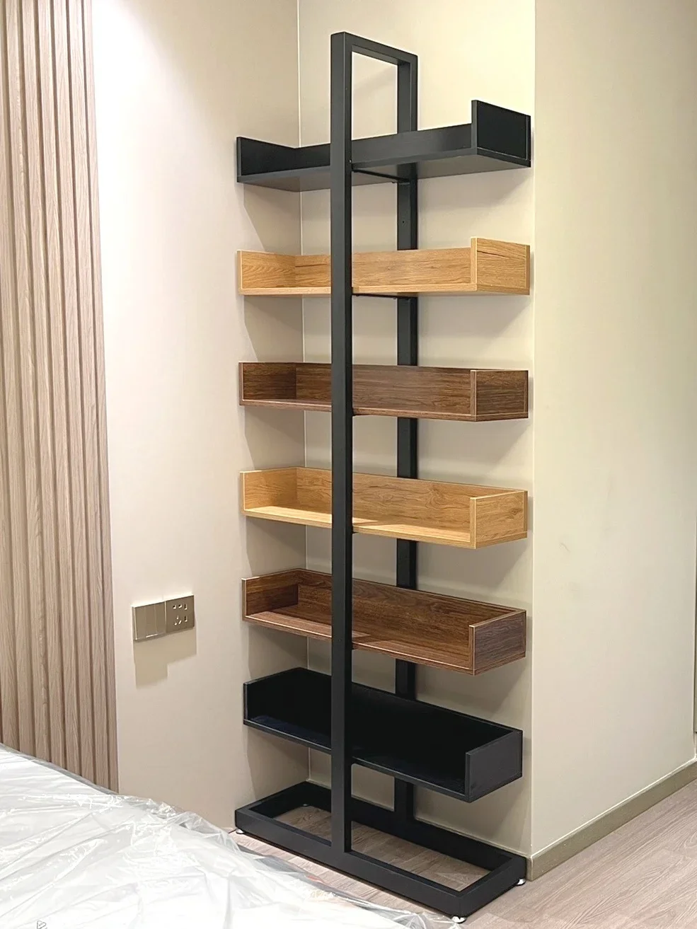 large bookcase display shelf at the end of the bed, colorful figure children's picture book rack, wall narrow gap