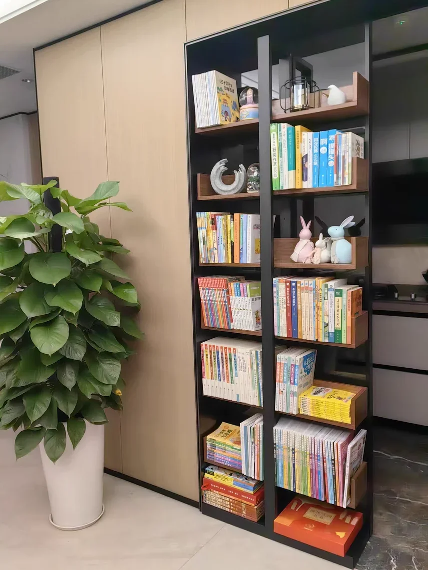 large bookcase display shelf at the end of the bed, colorful figure children's picture book rack, wall narrow gap