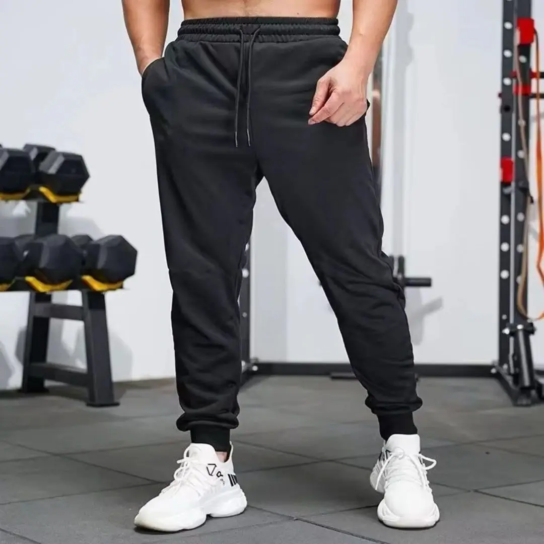 Muscle Fitness Brothers 새로운 여름 트렌드 캐주얼 스포츠 바지 야외 달리기 통기성 경량 작은 발바닥 바지