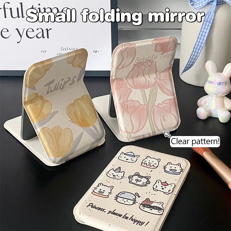 단색 PU 가죽 심플 데스크탑 메이크업 거울 휴대용 핸드헬드 메이크업 거울 접이식 학생용 컴팩트 귀여운 포켓 거울