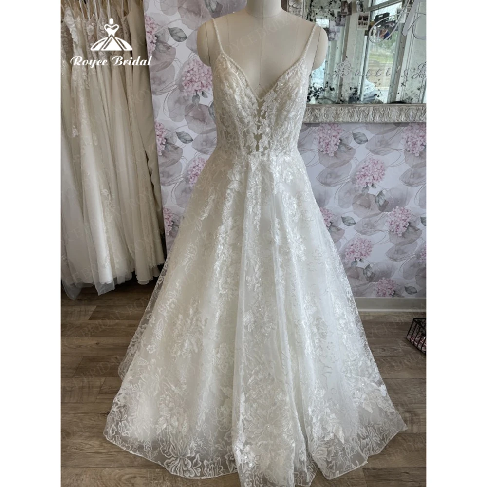 

Roycebridal A line V neck Appliques Lace Spaghetti Strap Wedding Dress 2023 Boho Backless Beading Court Train Wedding Party