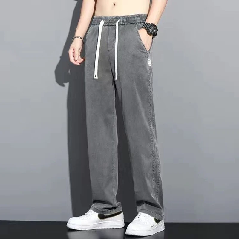 

2023 Spring Summer New Solid Color Wide Leg Trousers Man Elastic Waist Pockets Fashion Casual Ice Silk Fabric Cowboy Trousers