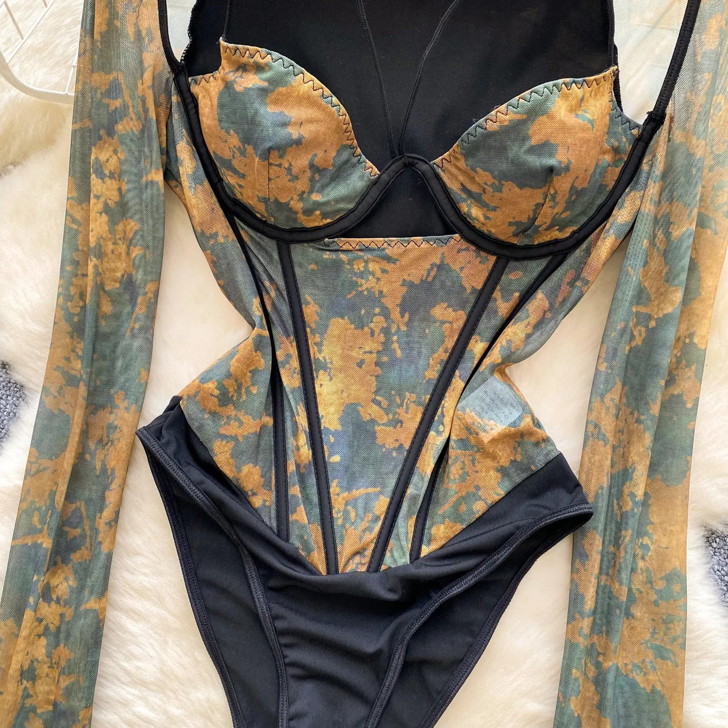 patchwork print close up on bodysuit