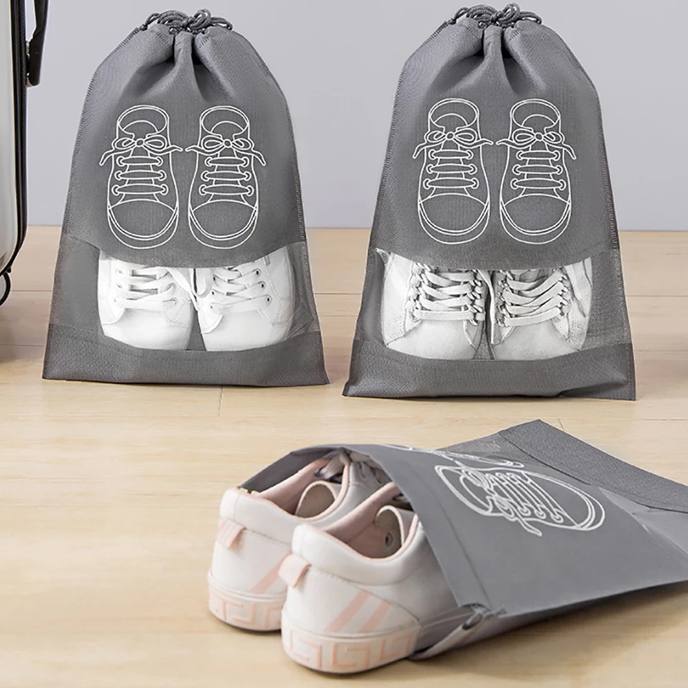 https://ae01.alicdn.com/kf/S6ac7f201796643d7aa23709b38f4010fR/Shoes-Storage-Bag-Nonwoven-Travel-Portable-Shoes-Bag-Closet-Dustproof-Storage-Bag-Drawstring-Classified-Organizer.jpg