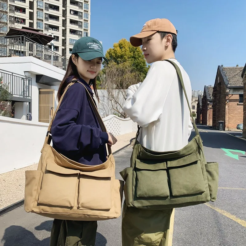 

2023 Japanese Style Unisex Messenger bag Large Capacity cross body bag Multi Pockets canvas white bag Casual brand woman bags