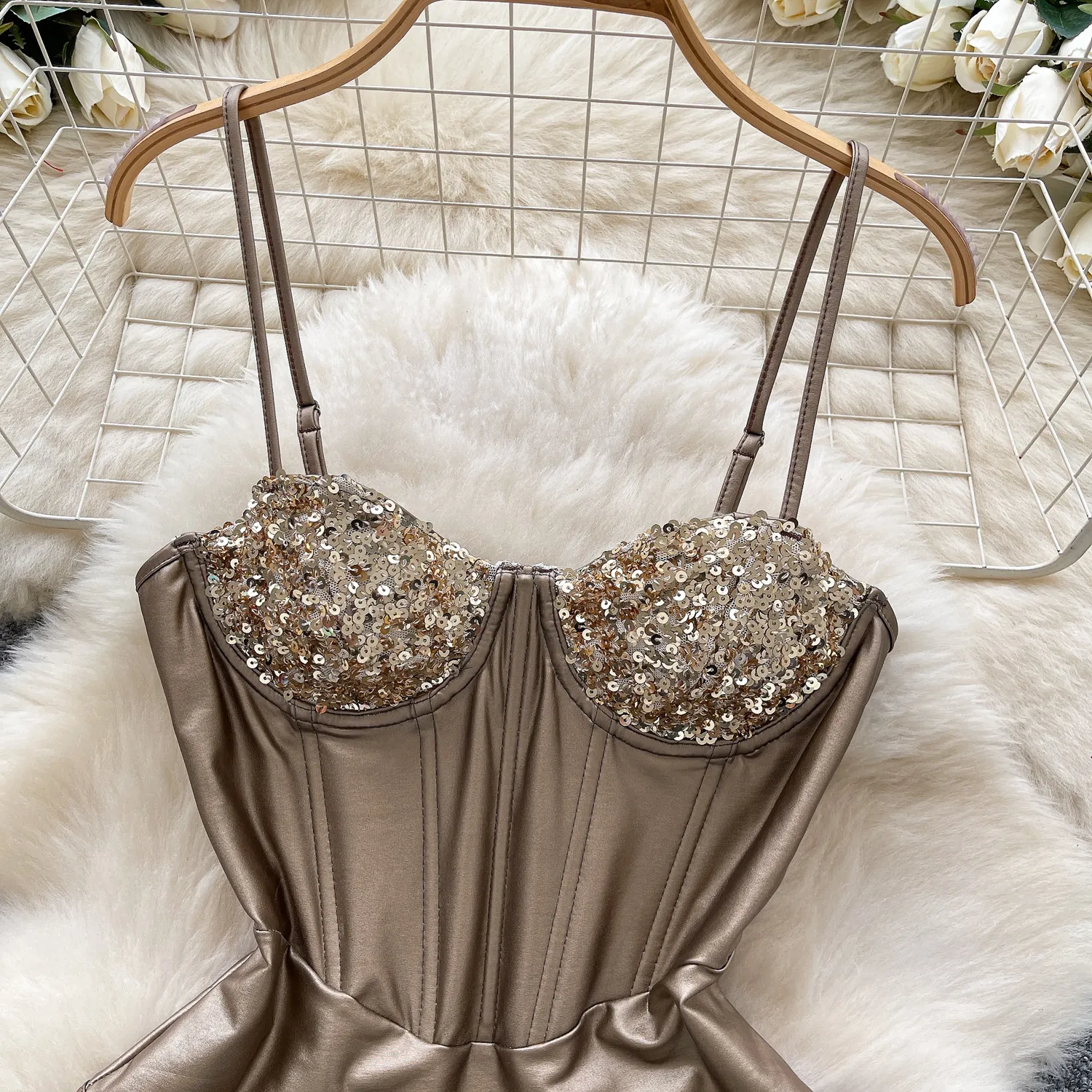 sparkling cup detail on sequin corset bodysuit