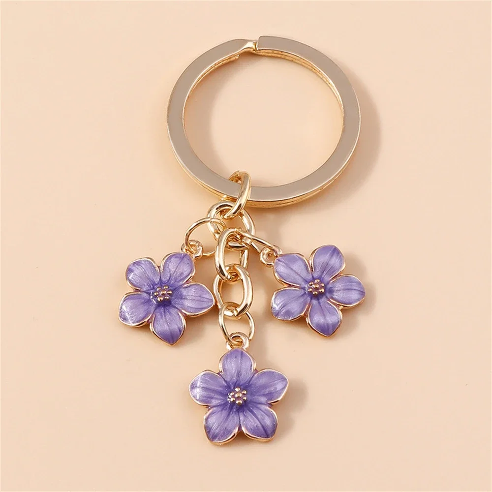 CAZSTYK Portachiavi coordinato con ciondolo a forma di fiore di ciliegio, in robusto acciaio inox, per donne alla moda e con fiori di ciliegio, A, Taglia unica