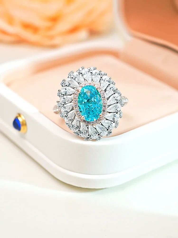 

2024 Light Luxury Topa Blue Ice Cut 925 Sterling Silver Sea Blue Treasure Ring Set with High Carbon Diamond Flower Wedding