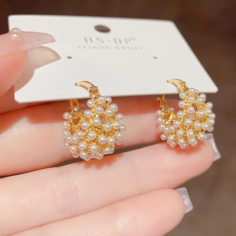 Haute couture French cutout basket full of pearl earrings for