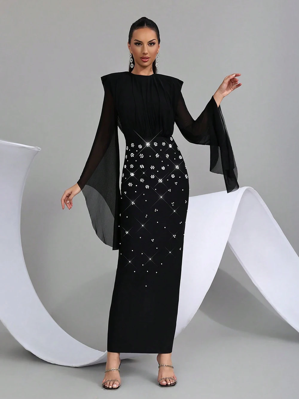 Crystal embellishment and cape detail