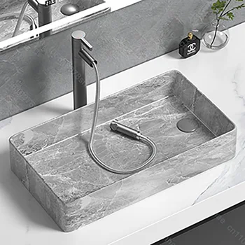 อ่างล้างหน้าเซรามิกดีไซน์หรูทันสมัยสำหรับห้องน้ำ อ่างล้างหน้าแบบวางบนเคาน์เตอร์พร้อมอุปกรณ์ระบายน้ำ 1