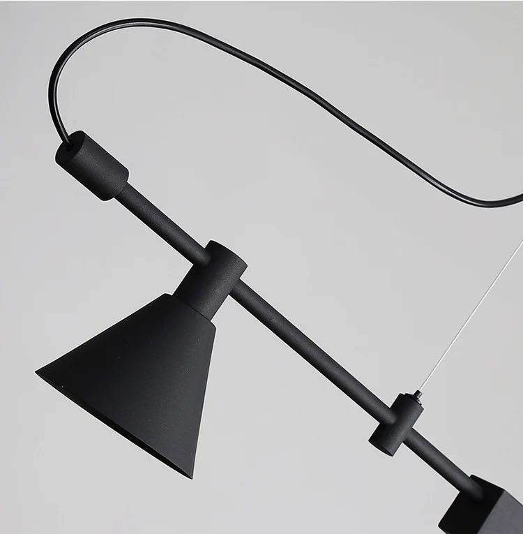 A black Modern Track Lighting pendant lamp features a conical shade and an industrial-inspired sleek metal rod design against a plain background.