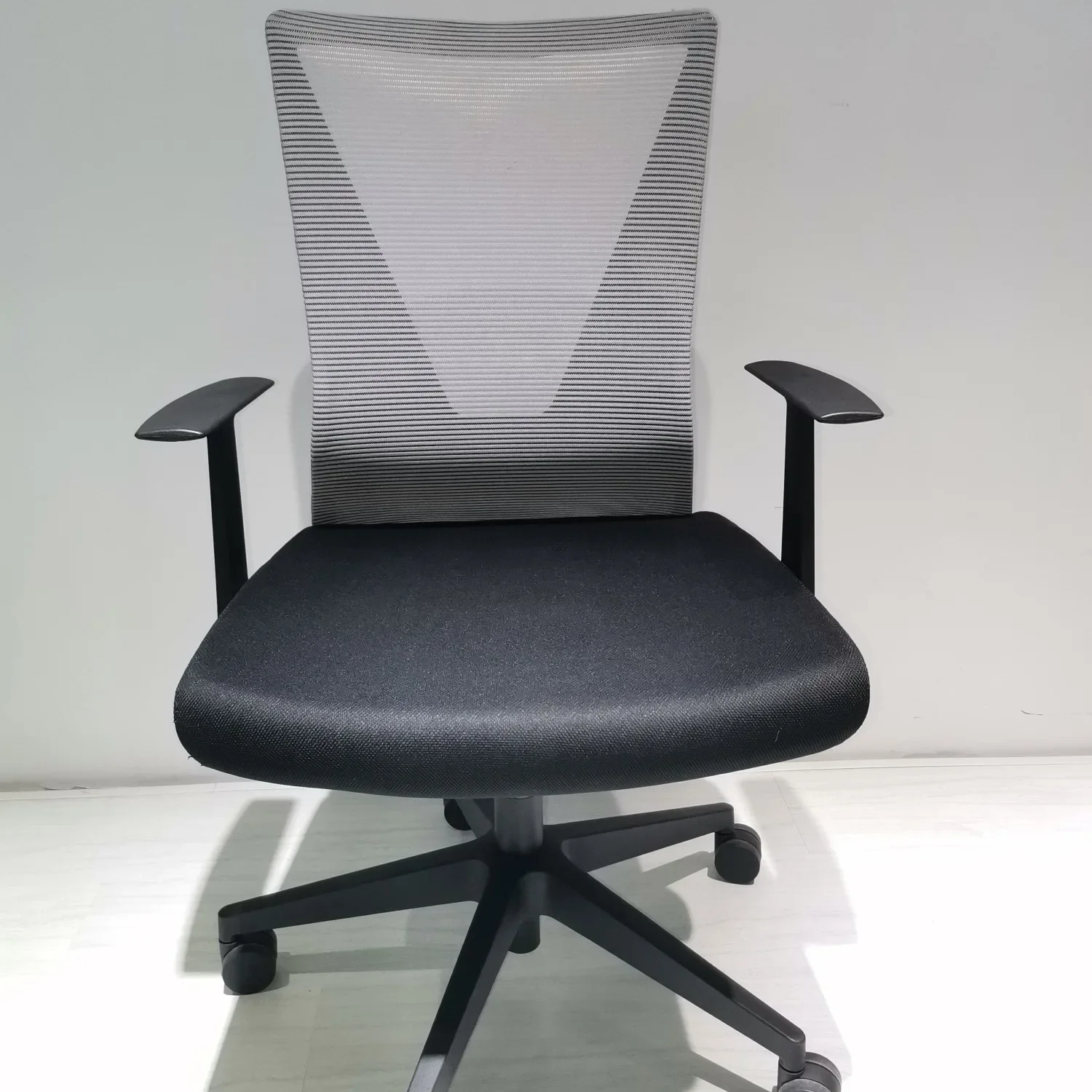 

Modern, Ergonomic Nicolas Swivel Office Chair with Adjustable Height, Fixed Armrest, Black Wengue, and Smokey Oak Design for Com