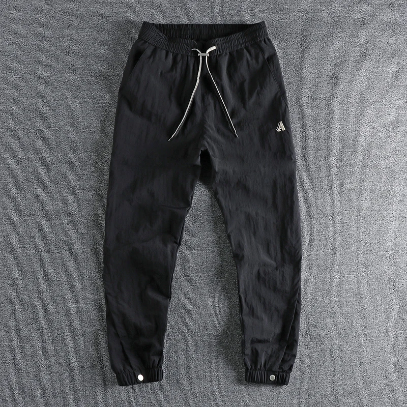 

2022 Design Feeling Cool and Breathable Retro Trend Ice Silk Quick-drying Casual Pants Men's Summer Loose Leggings Youth Pants