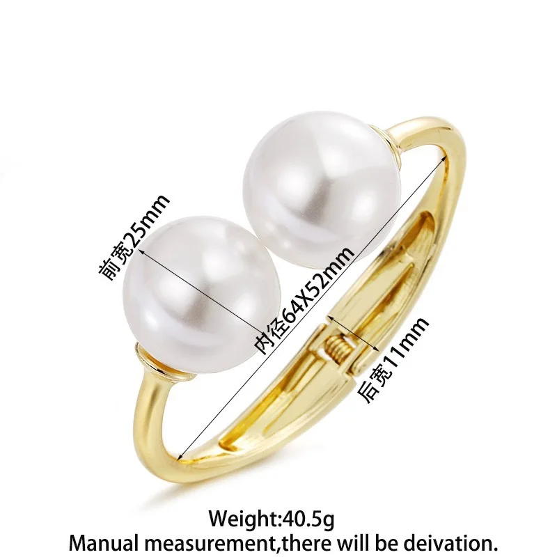 Gold-tone cuff bracelet with pearl ends for women – wide statement bangle with modern fashion appeal.